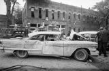 Damaged car in the street after the bombing of 16th Street Baptist Church in Birmingham, Alabama.