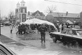 Civil rights demonstrators standing in the rain at the "Berlin Wall" on Sylvan Street in Selma, Alabama.