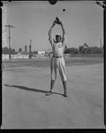 Baseball pitcher Satchel Page in a baseball field ready to pitch, Los Angeles, circa 1933