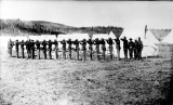 24th Infantry with rifles at the ready in front of tents