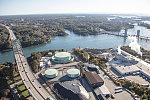 An October 2017 aerial view of the historic seaport of Portsmouth, New Hampshire, the largest city along the shortest coastline (18 miles) of any U.S. state. To the left is the Piscataqua River Bridge, a through arch bridge that crosses the Piscataqua River, connecting Portsmouth with Kittery, Maine