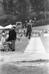 Carl Lewis completing a broad jump, Los Angeles, 1982