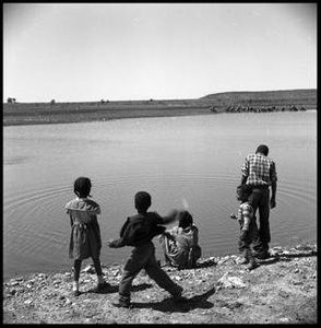 Children on the Edge of a Pond