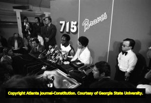 Hank Aaron fielding questions at a press conference after breaking Babe Ruth's homerun record, 1974