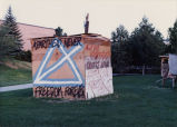 Image of signs, protests and displays put together by the SAA group on the University of Utah campus during political activity of the worldwide community to put an end to segregation in South Africa.