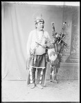 Full figure, Fred Murie, wearing Pawnee costume, Skidi Pawnee, Oklahoma 1904