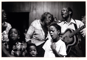 Doc and Lucy Barnes with kids singing