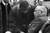 Ralph Abernathy speaking to Martin Luther King, Sr. at the funeral of his son Martin Luther King, Jr.