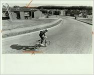 Atlanta Subsidized Housing, Boy Rides Bike Outside of Public Housing Project, January 8, 1984