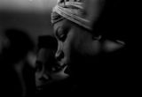 Young woman waiting to receive a bag of food from the Alabama Action Committee at Bell Street Baptist Church in Montgomery, Alabama.