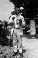 Bettis Academy? Unidentified man eating watermelon