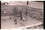 Pair of Tennessee walking horses pulling a jockey wire sculpture by Vannoy Streeter