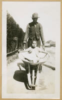 Toddler in Wheelbarrow, circa 1930