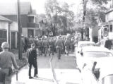 Police march down street after riot, Rochester, NY, 1964