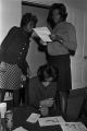 Barbara Howard Flowers and Viola Bradford judging contest entries in a house or apartment in Montgomery, Alabama.