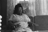 Fannie Bell Chapman: Centreville, Miss. Mrs. Chapman in house explaining healing with hands (FCP 15-72-7 #423)