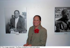 Rose Burke posing with portrait