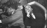 Joseph Lowery and Martin Luther King, Jr., seated behind the speaker during a meeting at St. Paul AME Church in Birmingham, Alabama.