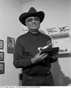 John F. Briggs holding one of his model airplanes #2