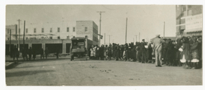 Photograph of people standing in a line on a street in Tulsa, Oklahoma