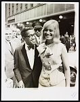 Crowd pleasers Mr. and Mrs. Sammy Davis Jr. in good spirits as they attended the premiere of "The Roar of the Greasepaint - The Smell of the Crowd," at the Shubert Theater /