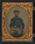 [Unidentified soldier in Union corporal's uniform and 17th Pennsylvania Cavalry Regiment slouch cap with U.S. Model 1860 cavalry saber]