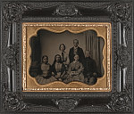 [Unidentified soldier in Union uniform with four women, one holding photograph, and one man, probably family]