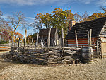 Slave cabin (left) and tobacco barn at the American Revolution Museum in Yorktown, Virginia