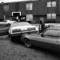 Cars moved by floodwaters, possibly at Delwood Manor Apartments in Mobile, Alabama.