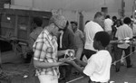 Friends feeding friends, Los Angeles, 1986