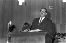 Man speaking to an audience at Holt Street Baptist Church in Montgomery, Alabama.