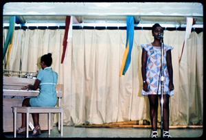 African-American Singer Performs Onstage with Pianist