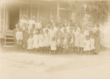 African American students outside a school building in Chatom, Alabama.