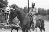 Othar Turner: Gravel Springs and Senatobia, Miss. Fife and drum. Making and playing fife, with horse (OTP 1-76-8 #1136)