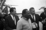 Martin Luther King Jr. getting off a plane at the airport in Birmingham, Alabama.