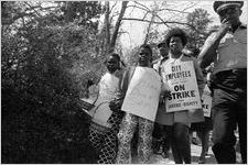 Sanitation workers strike supporters marching on Martin Luther King Jr. Drive in downtown Atlanta, Georgia, March 28, 1970. Photograph is part of a series labeled "Strike march."