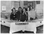 [Group portrait of five women belonging to the NAACP Planning Committee standing behind two tables with sign reading "Join NAACP Now"]