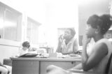 Young women seated at desks in an office, possibly the headquarters of the SCLC in Montgomery, Alabama.