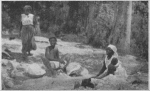 Haitian women washing clothes in a river