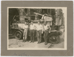 New York City fire fighter Wesley A. Williams (right) with three of his fellow fire fighters posing with a fire truck at Engine Company No. 55, in Manhattan's Lower East Side