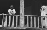 Jasper Wood Collection: Boy in Cleveland Indians shirt on porch