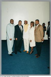 Group photograph of Albert Lipscomb (middle) with three men and one woman