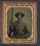 [Unidentified soldier in Confederate infantry uniform with model 1842 musket and two Colt revolvers]