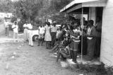 Large group standing on the porch of the Autauga County Improvement Association office in Prattville, Alabama, on the day of a civil rights march.