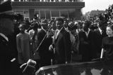 Man walking down Auburn Avenue toward Ebenezer Baptist Church for Martin Luther King, Jr.'s funeral.