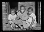 Negro children in doorway of alley home. Logan Alley, Northwest Washington, D.C.