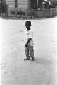 "Baby Brother" Tucker standing in the dirt road in front of a house in Newtown, a neighborhood in Montgomery, Alabama.