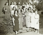 Group of women posing on a porch