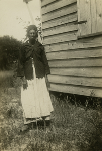 Katie Groverner [Grovernor] Brown next to her house at Racoon Bluff, Sapelo Island, Georgia