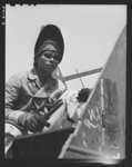 Construction of the liberty ship "Booker T. Washington." Jack Dover, Filipino welder assigned to work on the "Booker T. Washington," first liberty ship named for a Negro, is one of the workers of many racial groups who rushed to complete the vessel which bears the name of the noted Negro educator